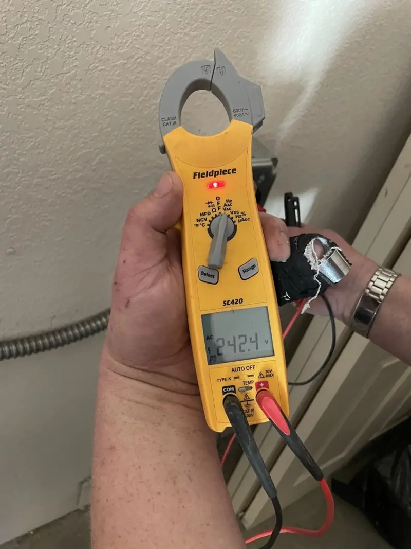 Voltage testing with clamp meter during Outlet Installation in Dumfries